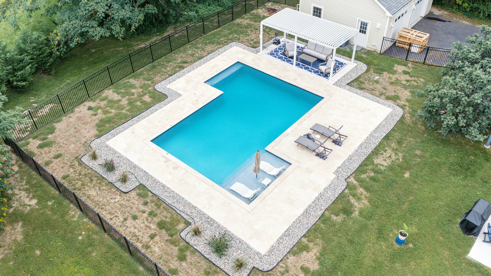 Aerial view of the pool and backyard