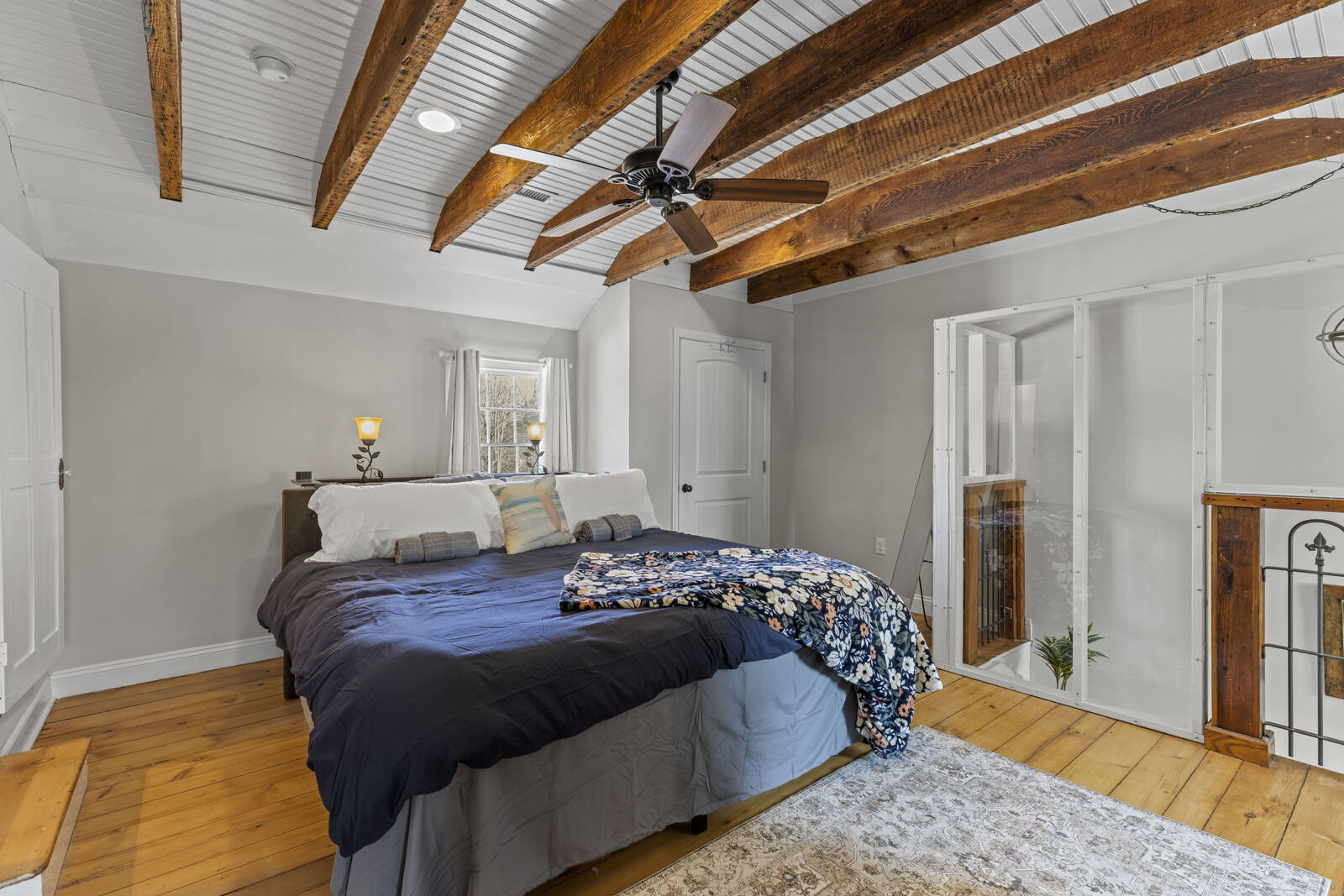 King bedroom with original exposed beams