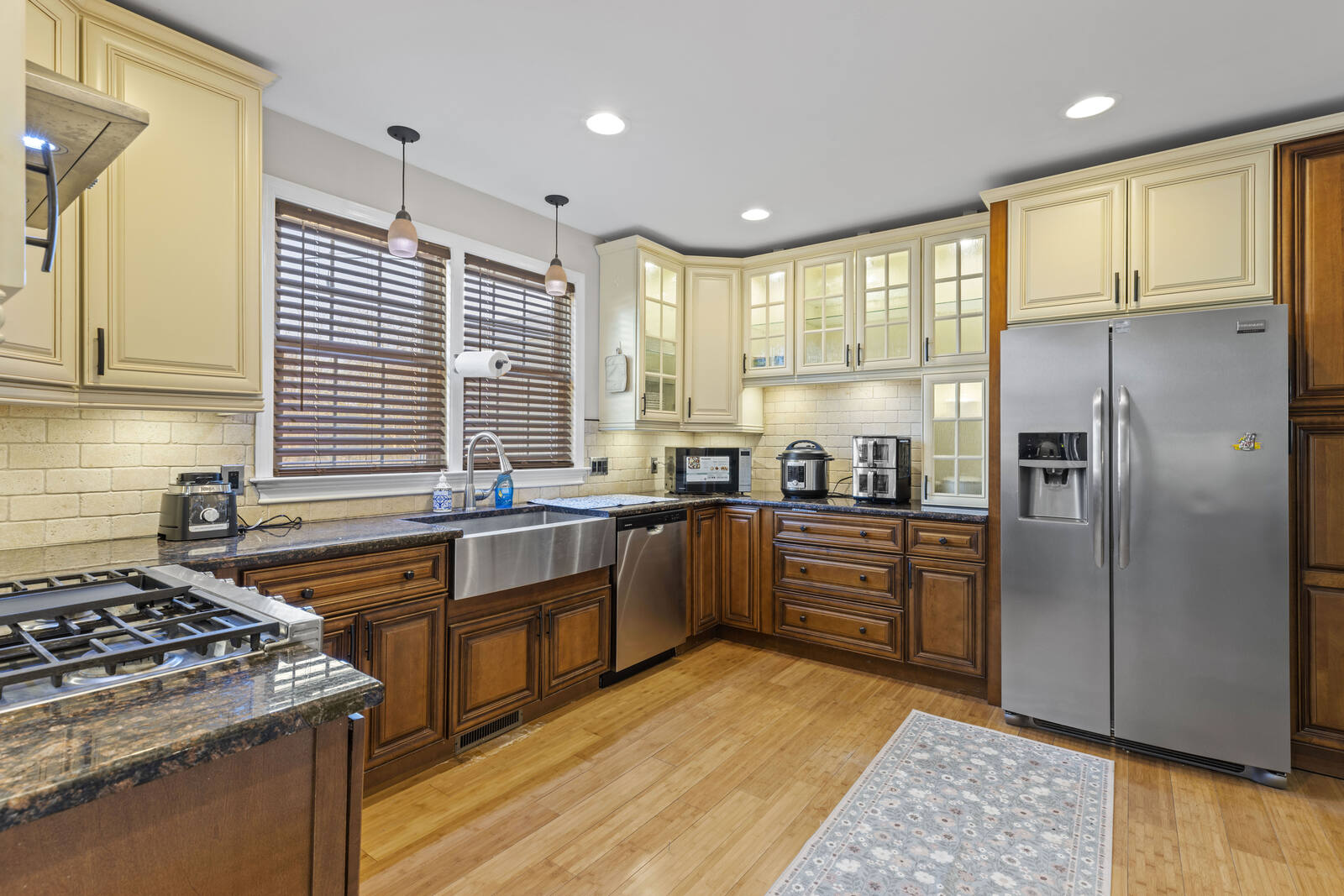 Full kitchen with island and stainless appliances