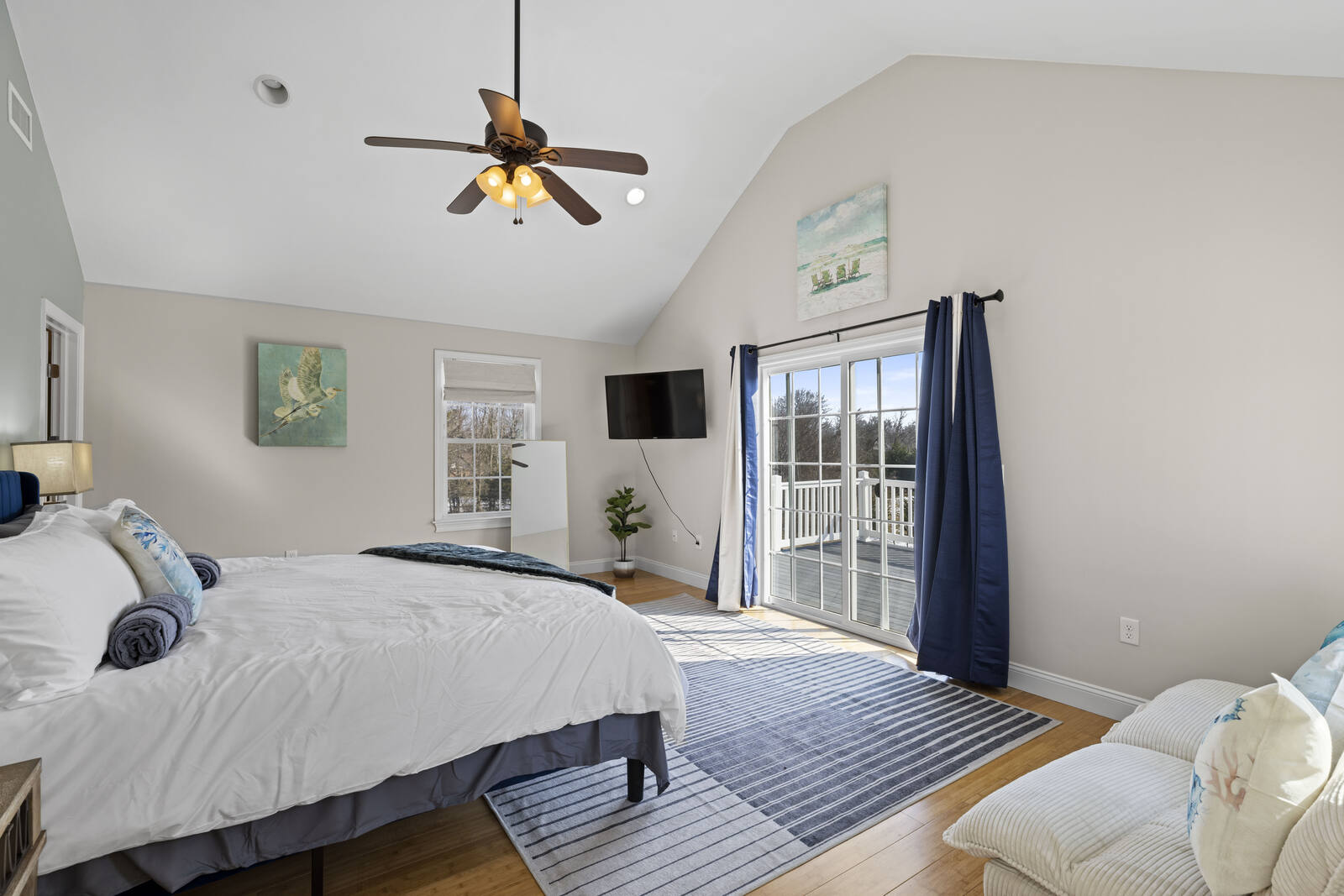 Master suite with vaulted ceiling and private deck